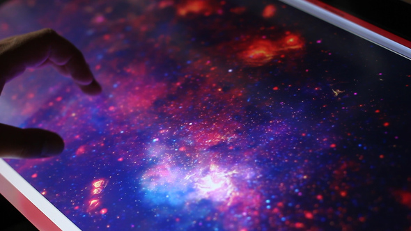 Illustration Of The Deep Space Galaxies On Touch Screen Computer