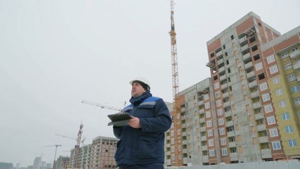 Foreman With Pad at Major Construction Project