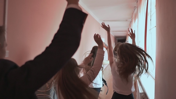 Happy Group Of High School Students Running Along Corridor, Stock Footage
