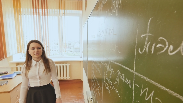 High School Student Answers at the Blackboard. School Theme. alt