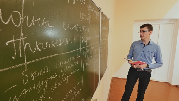 High School Student Answers at the Blackboard. School Theme. alt