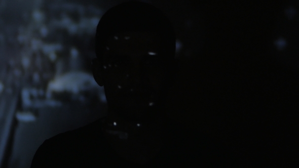 Timelapce Portrait of Young Man Watching a Video or Film on TV or a Computer Monitor. Reflection on alt