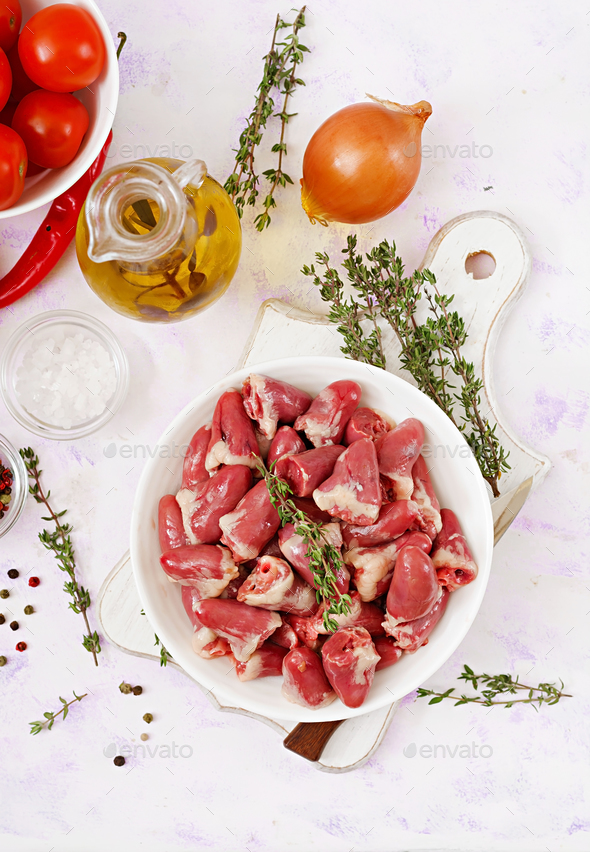 Ingredients for cooking chicken hearts with pumpkin and tomatoes in tomato sauce. - Stock Photo - Images