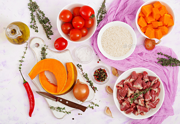 Ingredients for cooking chicken hearts with pumpkin and tomatoes in tomato sauce. - Stock Photo - Images
