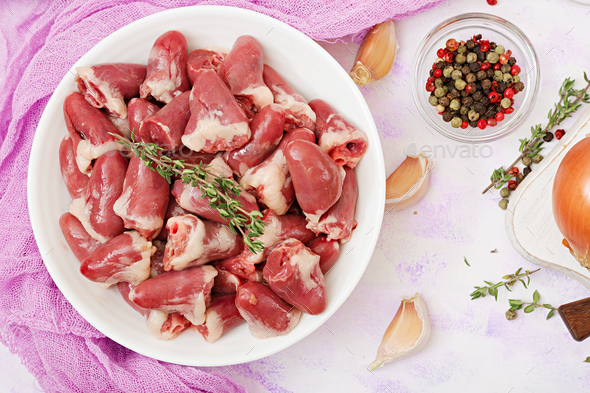 Ingredients for cooking chicken hearts with pumpkin and tomatoes in tomato sauce. - Stock Photo - Images