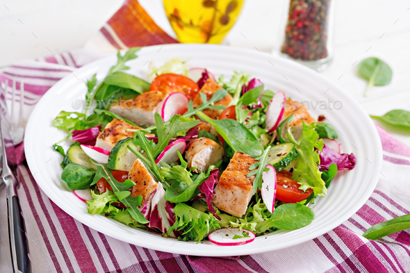 Fresh vegetable salad with grilled chicken breast - tomatoes, - Stock Photo - Images