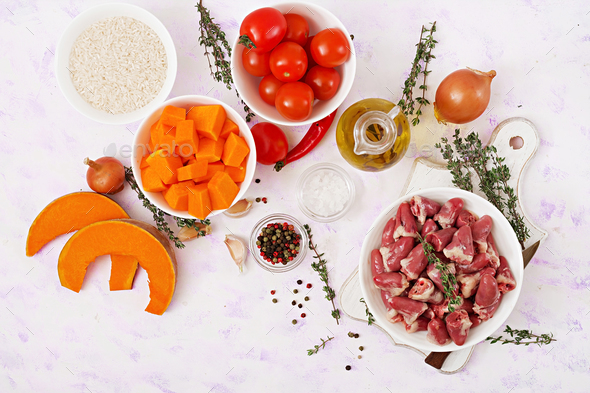 Ingredients for cooking chicken hearts with pumpkin and tomatoes in tomato sauce. - Stock Photo - Images
