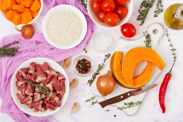 Ingredients for cooking chicken hearts with pumpkin and tomatoes in tomato sauce. - Stock Photo - Images