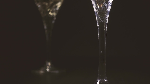 White Wine Flows Into the Wine Glass. The Camera Rises.