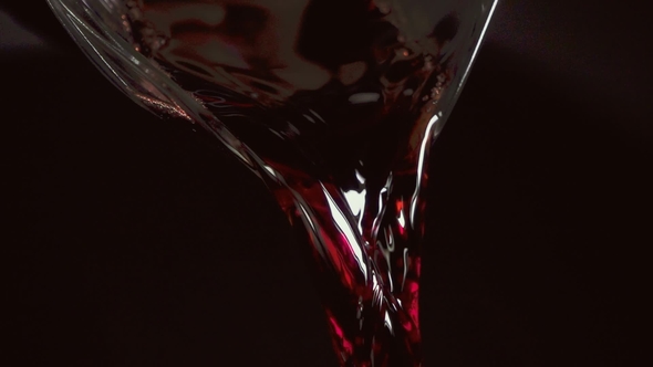 Red Wine Is Beautifully Poured From the Carafe