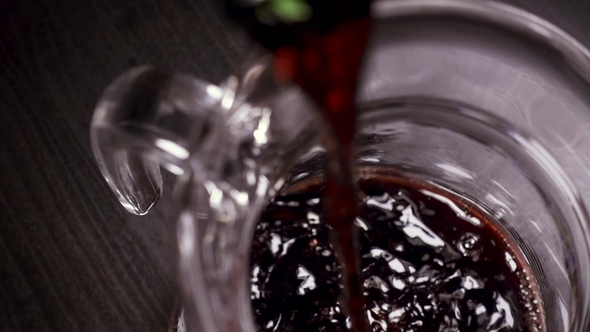 Wine Is Poured Into the Carafe From Above