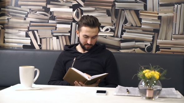 Man Is Looking in His Day Planner