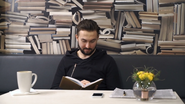 Businessman Is Cheking His Planner alt