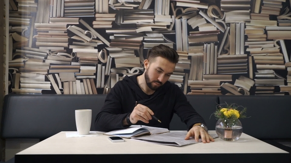 Businessman Is Searching Information in Newspaper