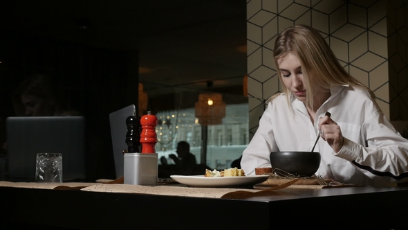 Charming Woman Is Eating Soup