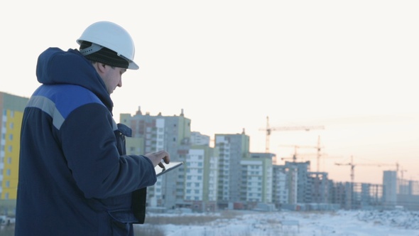 Foreman With Pad at Major Construction Project