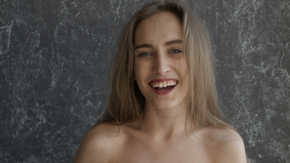 Naked Attractive Girl is Laughing