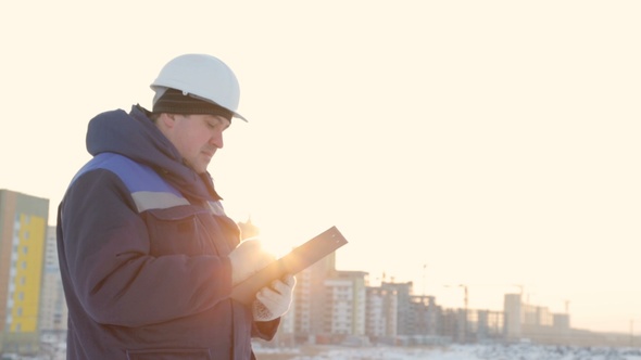 Foreman With Tablet at Major Construction Project