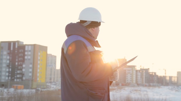 Foreman With Tablet at Major Construction Project