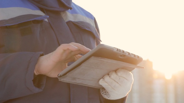 Foreman With Tablet at Major Construction Project