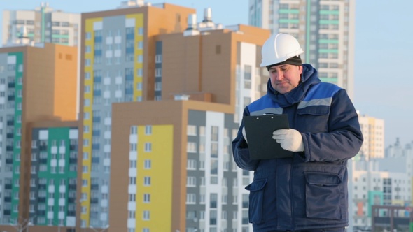 Foreman With Tablet at Major Construction Project