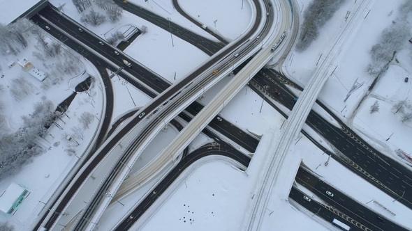 Aerial View of a Freeway Intersection Snow-covered in Winter alt