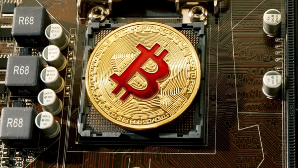 Gold Bit Coin BTC Coins on the Motherboard Bitcoin Is a Worldwide Cryptocurrency alt
