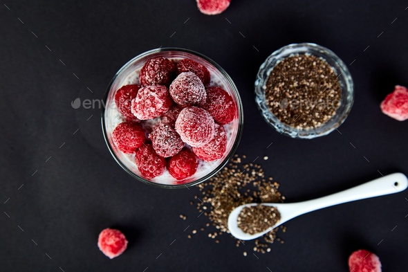 Healthy chia pudding with raspberries in glass - Stock Photo - Images