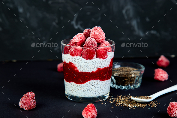 Healthy chia pudding with raspberries in glass - Stock Photo - Images