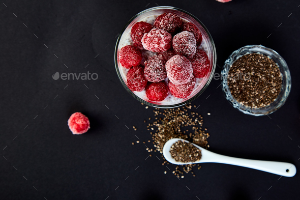 Healthy chia pudding with raspberries in glass - Stock Photo - Images