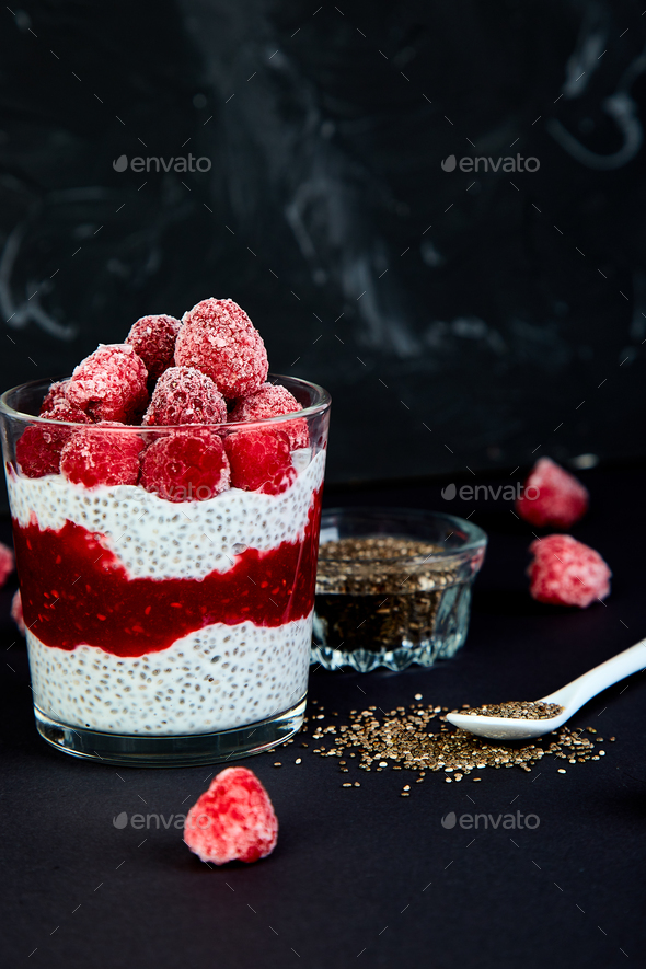 Healthy chia pudding with raspberries in glass - Stock Photo - Images