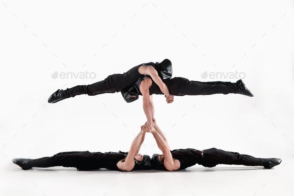 Acrobatic yoga in a gym stock image. Image of space, acrobatic - 57205871