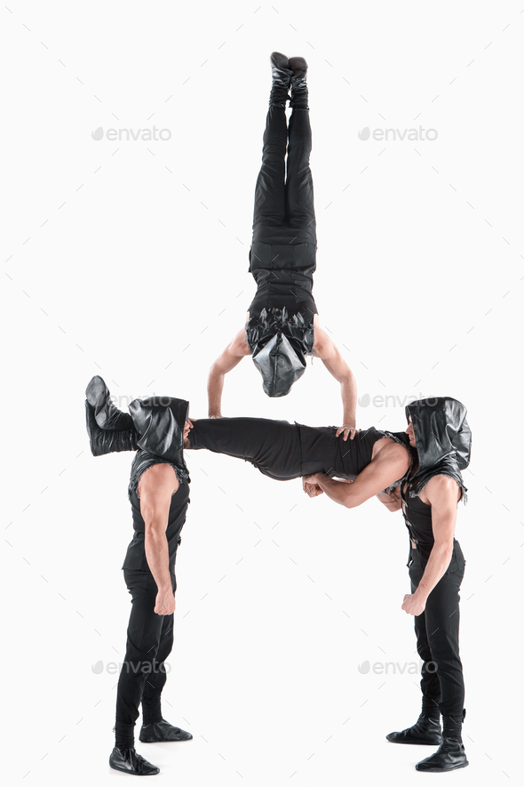 Acrobatic yoga in a gym stock image. Image of space, acrobatic - 57205871