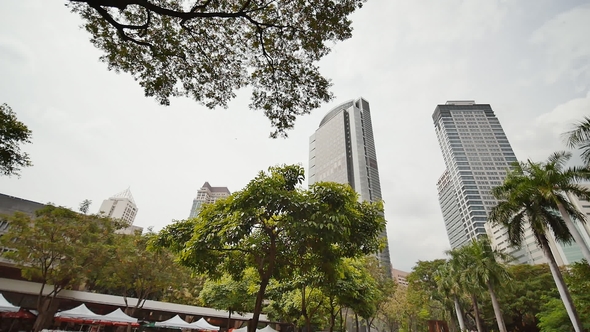 Gardens and Skyscrapers Seen at Ayala Triangle Park, in Makati, Metro Manila. alt