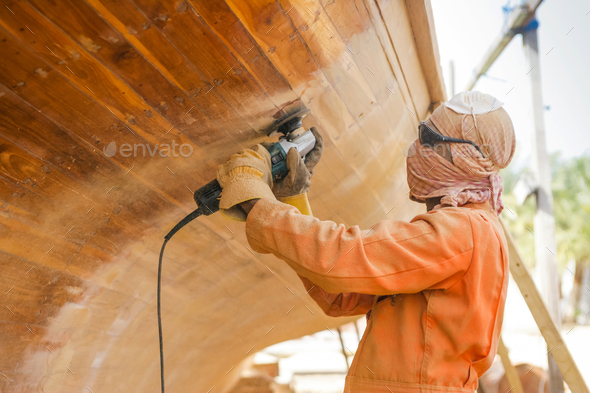 Worker at Abu Dhabi Boatyard - Stock Photo - Images