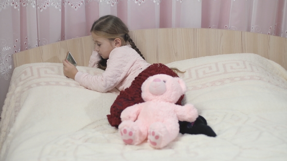 Girl Is Looking into the Phone alt