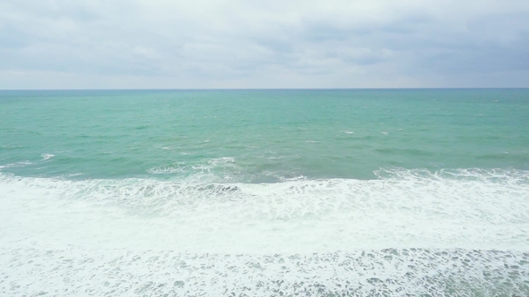 Sea with Foam Waves with a Beautiful Horizon