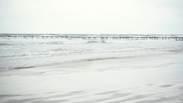Long Pier in the Stormy Sea