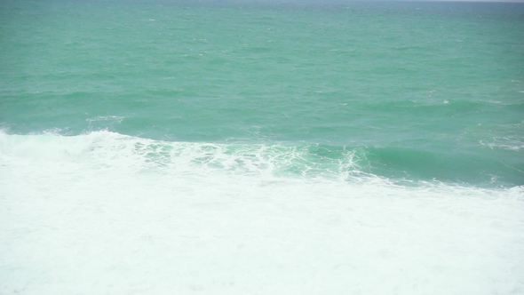 Blue Green Sea and White Foam Wave