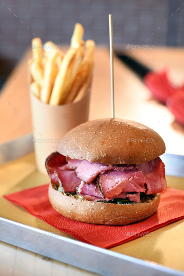 Tasty highly seasoned smoked pastrami sandwich - Stock Photo - Images