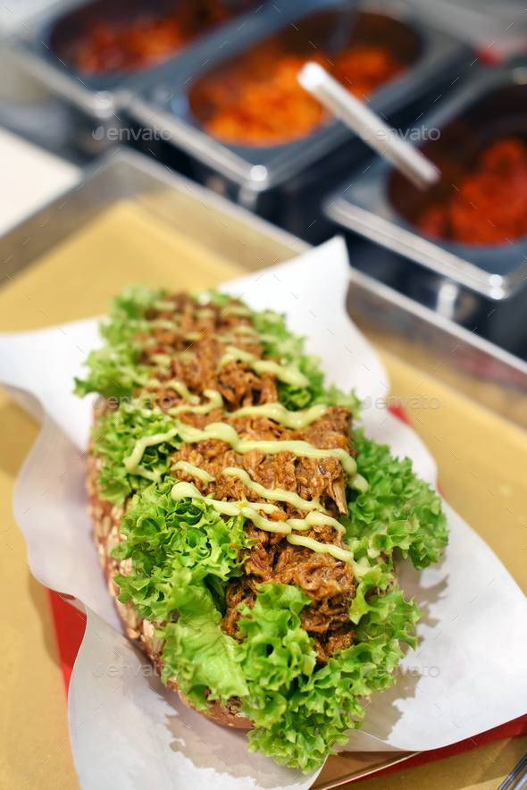Delicious pulled pork sandwich with dressing - Stock Photo - Images