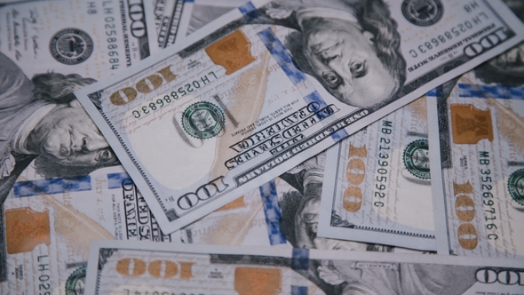 Background of Rotating Chaotic Scattered 100 Dollars Bills alt