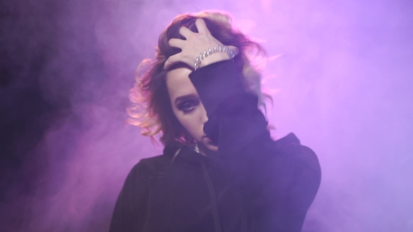 Sexy Girl is Touching Up Her Hair alt