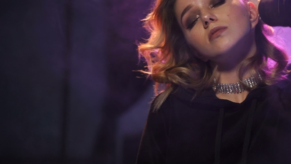 Attractive Girl Is Dancing in Night Club alt