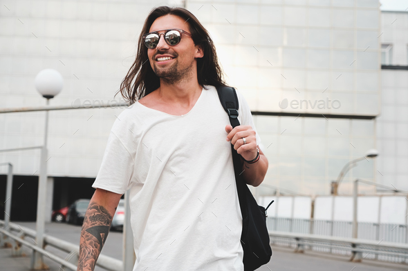 Happy man walking in the city - Stock Photo - Images