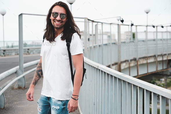 Smiling man hang out, walking in the city - Stock Photo - Images