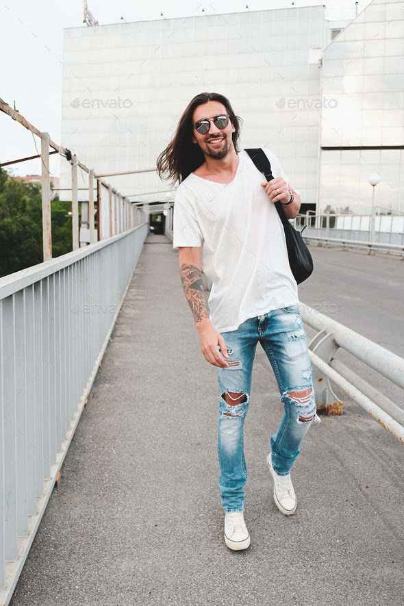 Happy man walking in the city - Stock Photo - Images