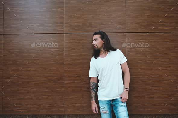 Attractive man with beard and long hair portrait - Stock Photo - Images