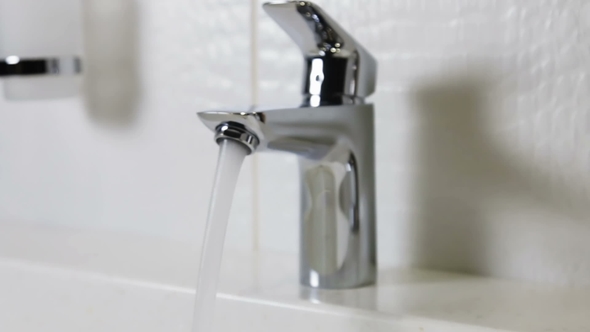 Water Faucet in a Luxurious Hotel Room or at Home