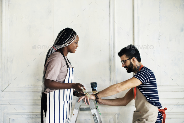 Couple renovating the house - Stock Photo - Images